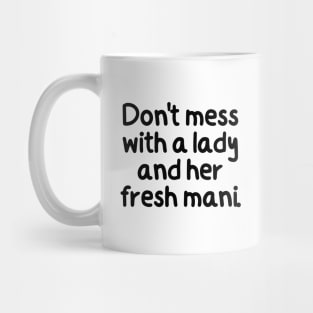 Don't mess with a lady and her fresh mani. Mug